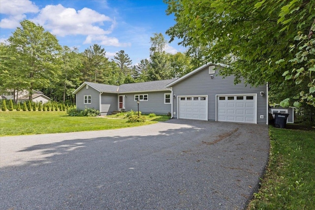 33 Winterlane Cir, Essex, VT 05452 - view of front of home with a front lawn, driveway, and a garage