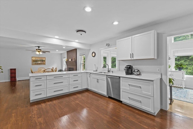 33 Winterlane Cir, Essex, VT 05452 - kitchen with dishwasher, a peninsula, dark wood-style floors, light countertops, and ceiling fan