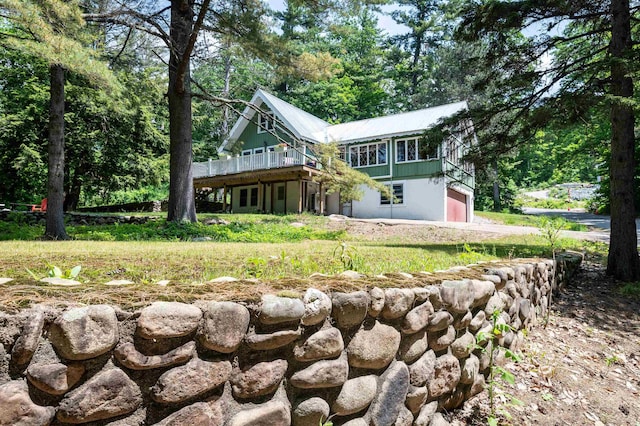 35 Alpstrausse Rd, Bartlett, NH 03845 - rear view of property with a garage and a wooden deck