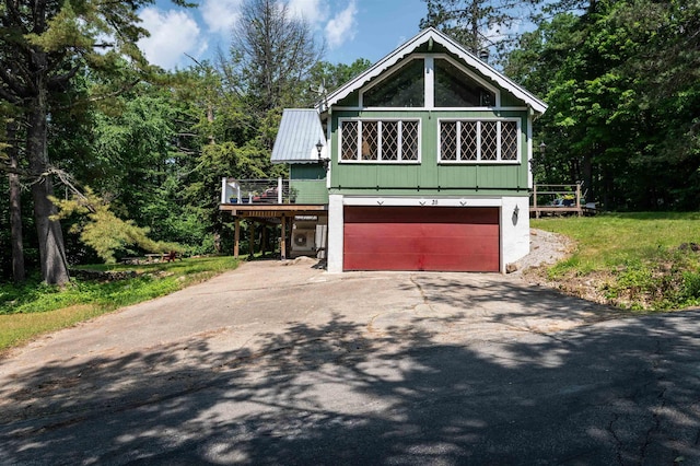 35 Alpstrausse Rd, Bartlett, NH 03845 - view of front of house featuring asphalt driveway, an attached garage, and a wooden deck