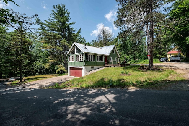 35 Alpstrausse Rd, Bartlett, NH 03845 - rustic home featuring driveway, an attached garage, a sunroom, and a metal roof