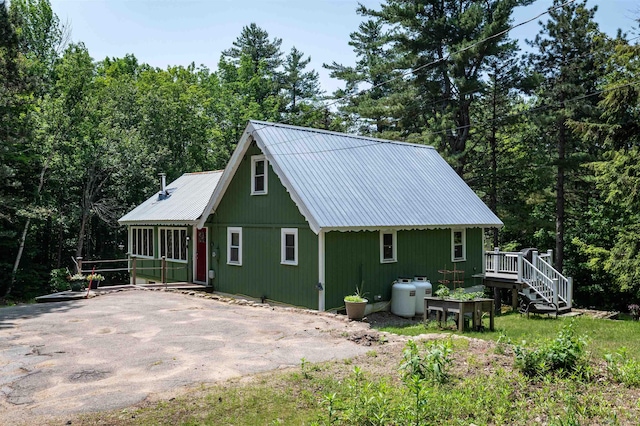 35 Alpstrausse Rd, Bartlett, NH 03845 - rear view of property with a deck, a metal roof, and a wooded view