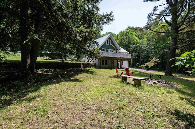 35 Alpstrausse Rd, Bartlett, NH 03845 - view of grassy yard with a wooden deck and a wooded view