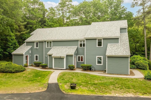 36 Circle Dr # 3, Ashland, NH 03217 - view of front of house featuring a shingled roof and a front lawn