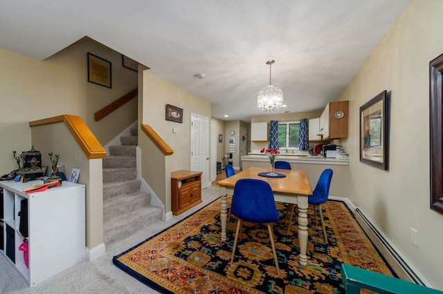 36 Circle Dr # 3, Ashland, NH 03217 - dining area with a baseboard radiator, stairway, a chandelier, and carpet flooring