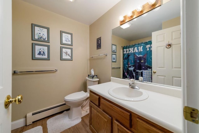 36 Circle Dr # 3, Ashland, NH 03217 - full bath featuring a baseboard heating unit, wood finished floors, and vanity