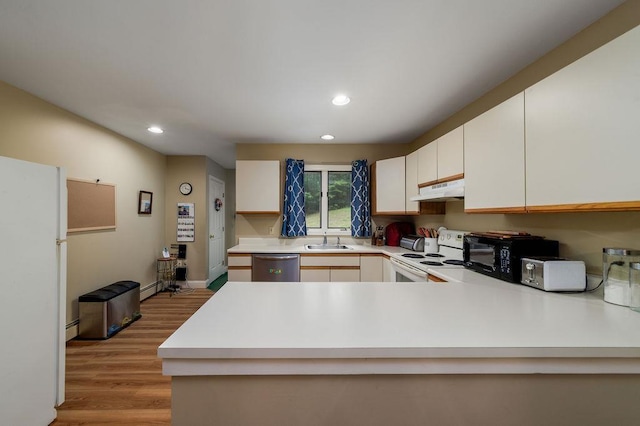 36 Circle Dr # 3, Ashland, NH 03217 - kitchen featuring white appliances, light countertops, light wood finished floors, recessed lighting, and under cabinet range hood