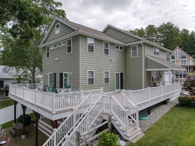 9 Blake Rd, Salem, NH 03079 - back of property with stairway, a deck, and a shingled roof