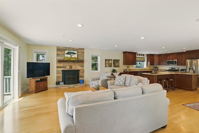 9 Blake Rd, Salem, NH 03079 - living area featuring light wood-type flooring and recessed lighting