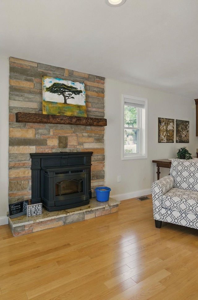 9 Blake Rd, Salem, NH 03079 - living area with wood finished floors and a fireplace