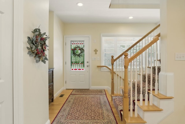 9 Blake Rd, Salem, NH 03079 - foyer with stairway, light wood finished floors, and recessed lighting