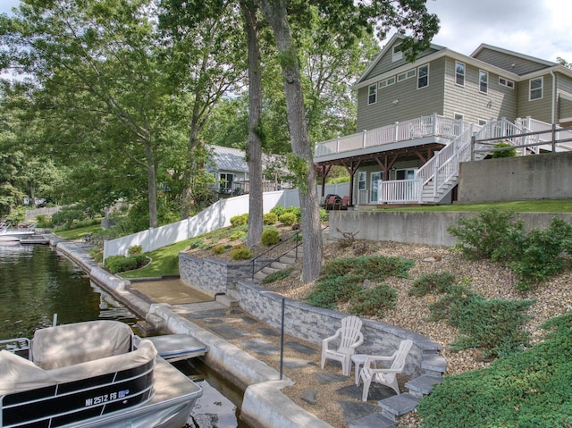 9 Blake Rd, Salem, NH 03079 - rear view of property with stairs and a deck with water view