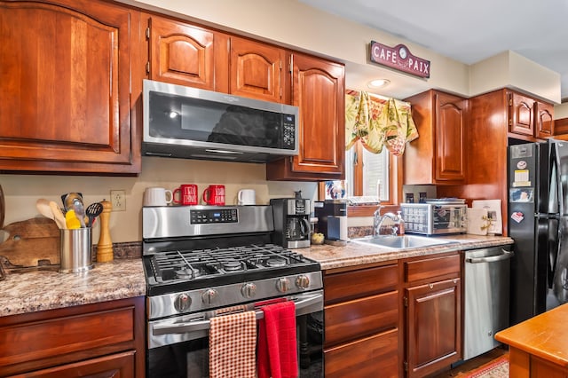 48 Merriman Forest Rd, Bartlett, NH 03812 - kitchen featuring stainless steel appliances, light countertops, and brown cabinetry