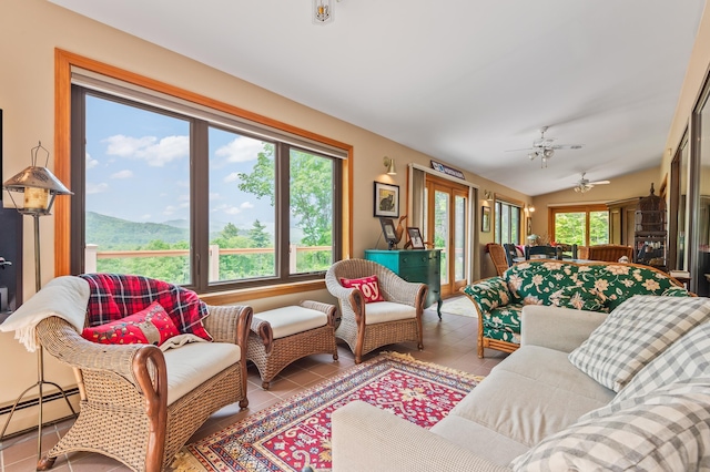 48 Merriman Forest Rd, Bartlett, NH 03812 - living area with a baseboard heating unit, tile patterned floors, and a ceiling fan