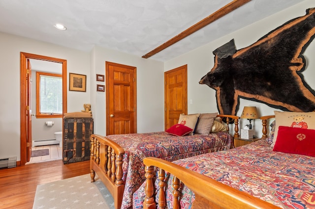 48 Merriman Forest Rd, Bartlett, NH 03812 - bedroom with a baseboard radiator, wood finished floors, and recessed lighting