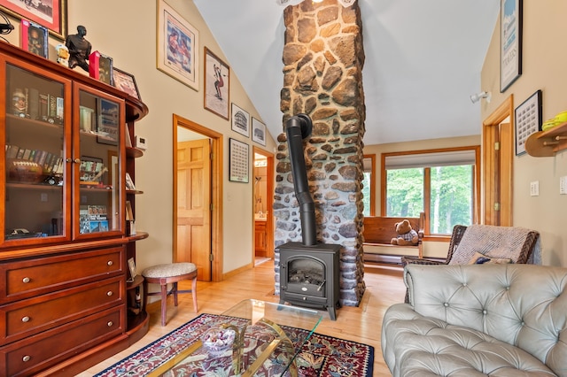 48 Merriman Forest Rd, Bartlett, NH 03812 - living room featuring a wood stove, light wood-type flooring, and high vaulted ceiling