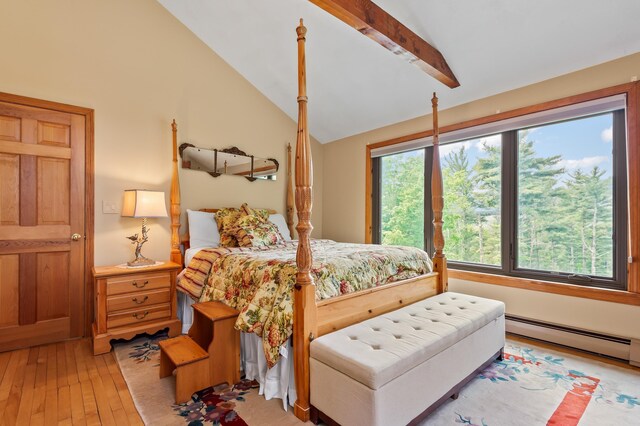 48 Merriman Forest Rd, Bartlett, NH 03812 - bedroom with vaulted ceiling, baseboard heating, and light wood-style flooring