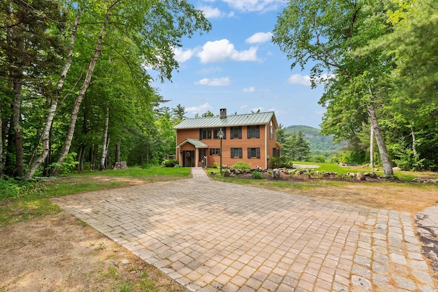 48 Merriman Forest Rd, Bartlett, NH 03812 - colonial home with a chimney, a metal roof, and a standing seam roof