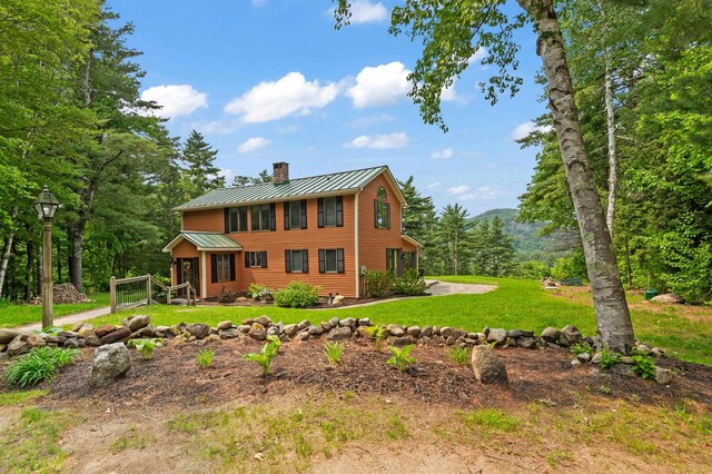 48 Merriman Forest Rd, Bartlett, NH 03812 - view of front of property featuring a chimney, a standing seam roof, a metal roof, and a front lawn