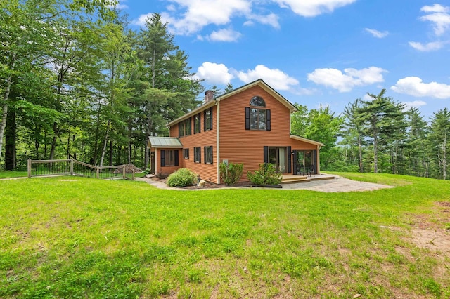 48 Merriman Forest Rd, Bartlett, NH 03812 - back of house with a chimney, a patio, and a lawn