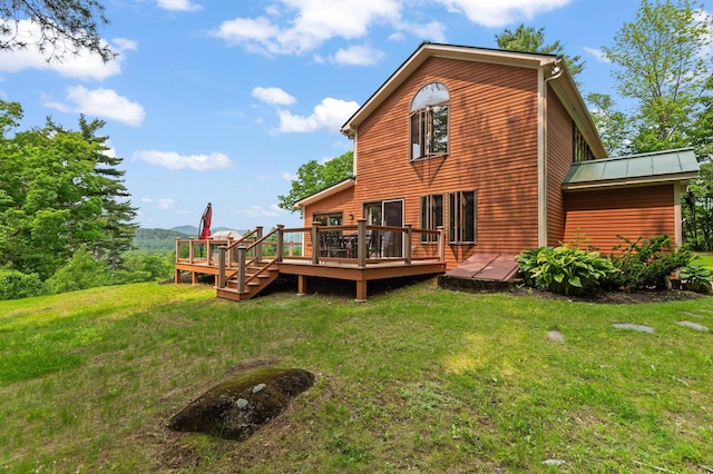48 Merriman Forest Rd, Bartlett, NH 03812 - rear view of house featuring a deck, a lawn, a standing seam roof, and a metal roof