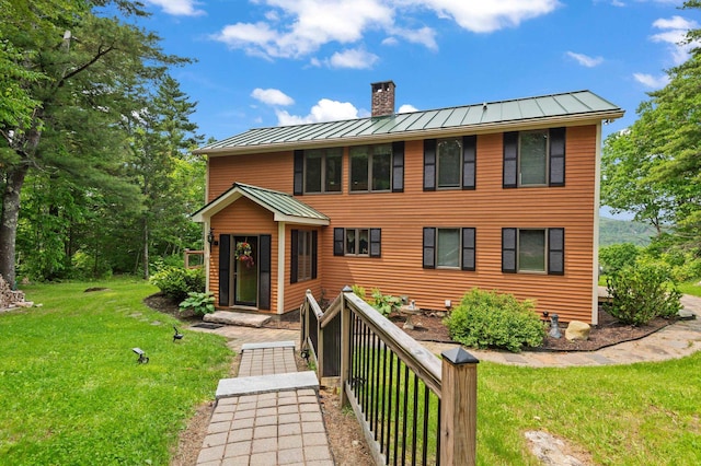 48 Merriman Forest Rd, Bartlett, NH 03812 - view of front of home with a standing seam roof, a chimney, a front yard, and a metal roof