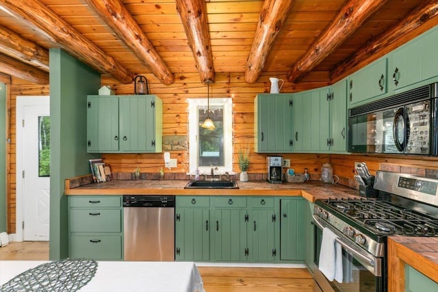 59 Ossipee Mountain Rd, Ossipee, NH 03814 - kitchen with stainless steel appliances, a wooden ceiling with exposed beams, light wood finished floors, decorative light fixtures, and tile countertops