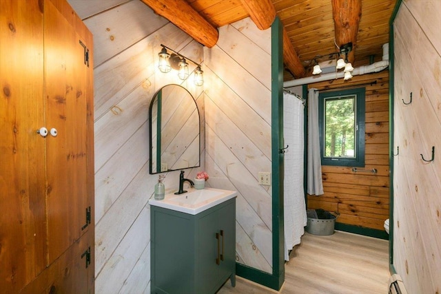 59 Ossipee Mountain Rd, Ossipee, NH 03814 - full bathroom featuring a wood ceiling with exposed beams, wooden walls, vanity, wood finished floors, and baseboard heating
