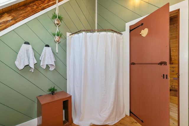 59 Ossipee Mountain Rd, Ossipee, NH 03814 - bathroom with a shower with shower curtain and wood finished floors