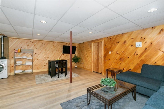 59 Ossipee Mountain Rd, Ossipee, NH 03814 - living room featuring wooden walls, wood finished floors, washer / dryer, and recessed lighting
