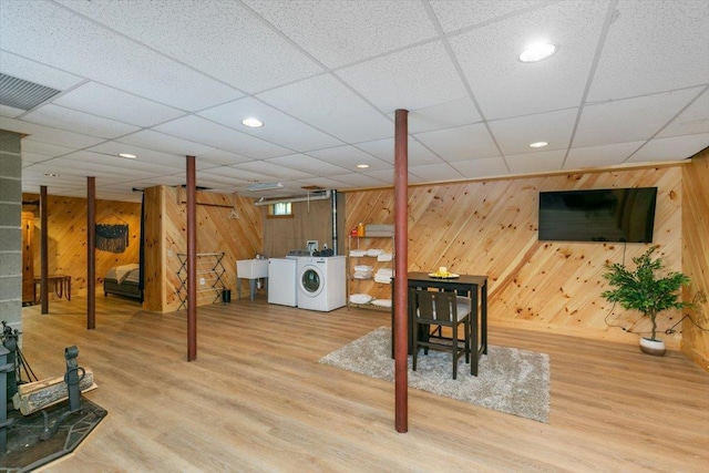 59 Ossipee Mountain Rd, Ossipee, NH 03814 - finished below grade area with wood walls, washing machine and clothes dryer, wood finished floors, and recessed lighting