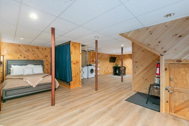 59 Ossipee Mountain Rd, Ossipee, NH 03814 - bedroom featuring wooden walls, washing machine and clothes dryer, wood finished floors, recessed lighting, and a drop ceiling