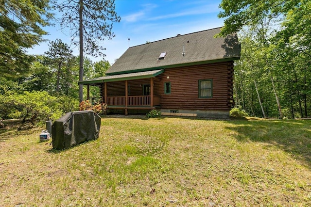 59 Ossipee Mountain Rd, Ossipee, NH 03814 - rear view of property with log exterior, a lawn, and a porch