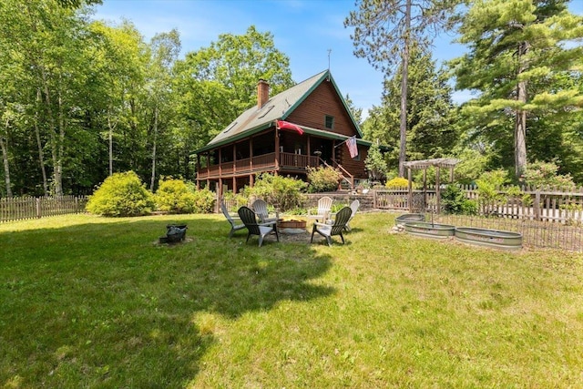 59 Ossipee Mountain Rd, Ossipee, NH 03814 - view of yard featuring an outdoor fire pit and a deck