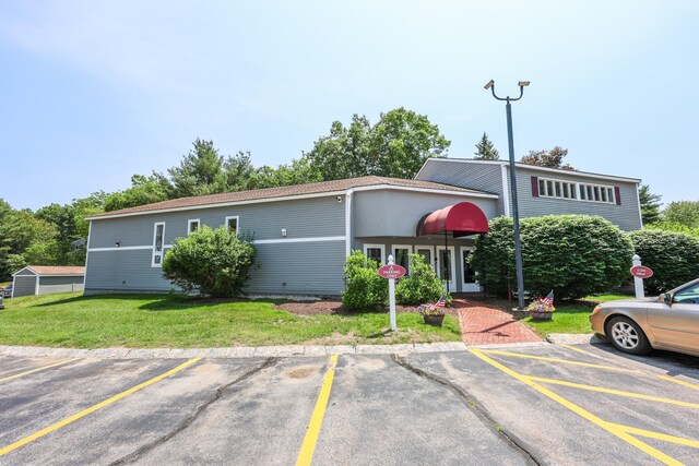 120 Fisherville Rd Unit 8, Concord, NH 03303 - view of front of property featuring uncovered parking and a front yard