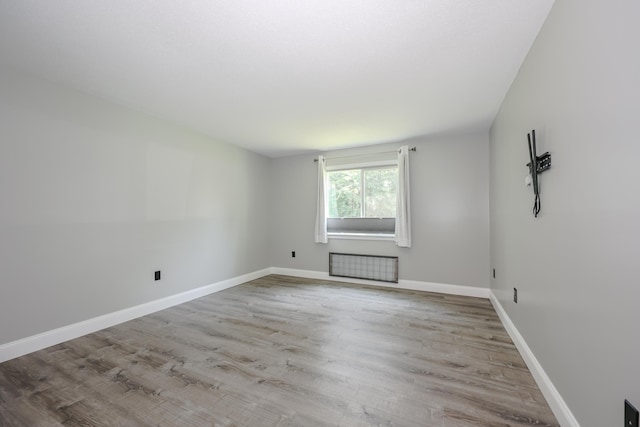 120 Fisherville Rd Unit 8, Concord, NH 03303 - spare room featuring wood finished floors and radiator