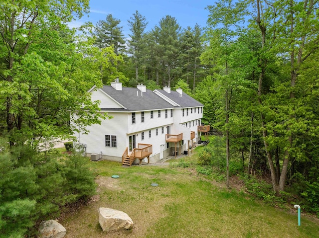 9 Old Nashua Rd Unit B-1, Amherst, NH 03031 - rear view of house featuring a chimney, a deck, and roof with shingles