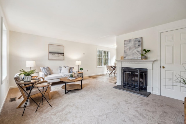9 Old Nashua Rd Unit B-1, Amherst, NH 03031 - living room featuring carpet and a fireplace with raised hearth