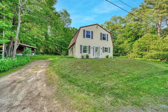 14 W Court Rd, Sunapee, NH 03782 - dutch colonial featuring a gambrel roof, dirt driveway, and a front lawn
