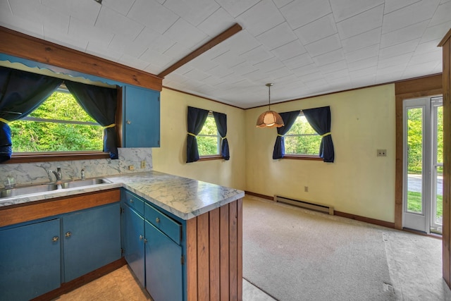 14 W Court Rd, Sunapee, NH 03782 - kitchen featuring blue cabinetry, a baseboard heating unit, a peninsula, backsplash, and light countertops