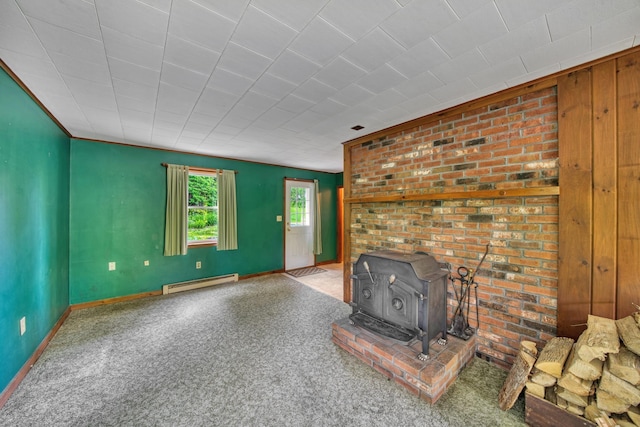 14 W Court Rd, Sunapee, NH 03782 - unfurnished living room featuring a wood stove, a baseboard heating unit, and carpet floors