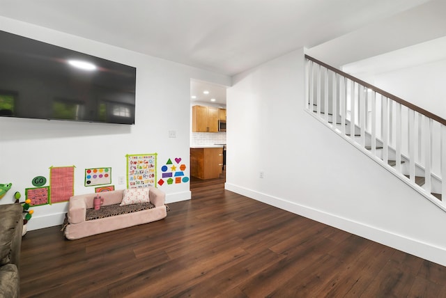 57 Central St, Farmington, NH 03835 - living area with dark wood-style floors, stairs, and recessed lighting