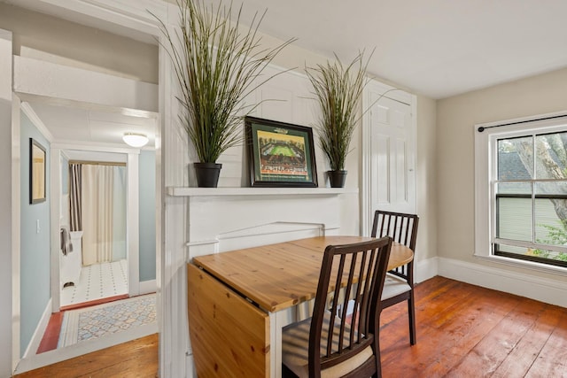 163B Locust St, Dover, NH 03820 - dining area featuring hardwood / wood-style flooring and baseboards