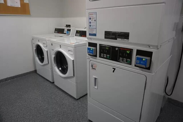 131 Main St Unit 308, Burlington, VT 05401 - communal laundry room with washing machine and clothes dryer and baseboards