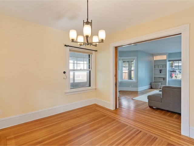 159 Loomis St, Burlington, VT 05401 - dining area featuring light wood-style floors and a chandelier