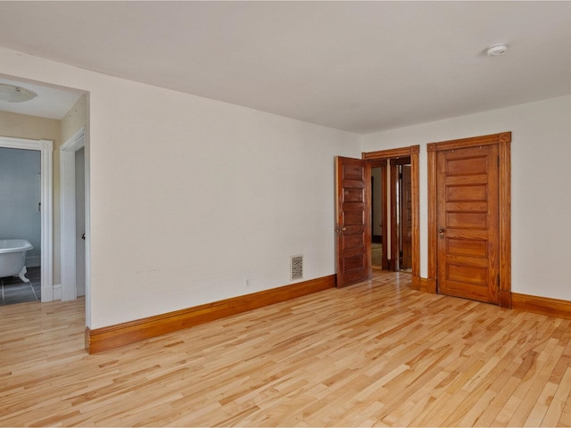159 Loomis St, Burlington, VT 05401 - empty room featuring light wood-style flooring and a smoke detector