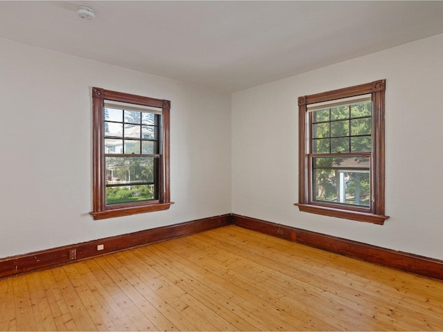 159 Loomis St, Burlington, VT 05401 - unfurnished room with a smoke detector, light wood-type flooring, and plenty of natural light