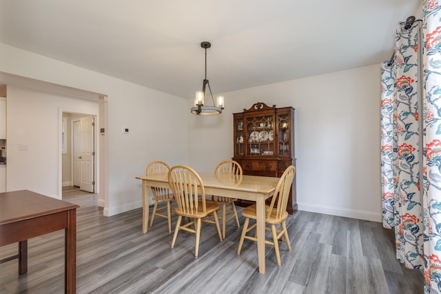 5 Turnpike St, Pembroke, NH 03275 - dining area featuring wood finished floors and a chandelier