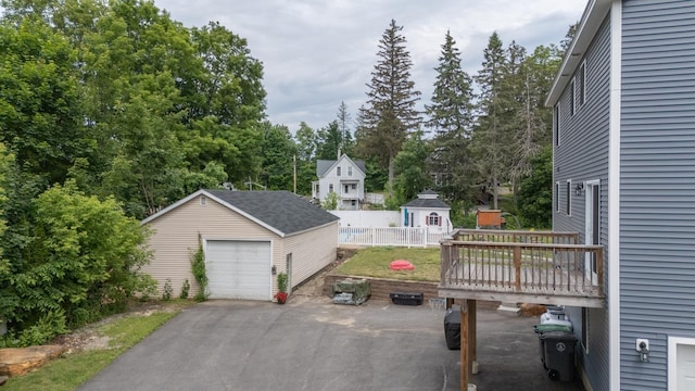 5 Turnpike St, Pembroke, NH 03275 - detached garage with asphalt driveway and view of scattered trees