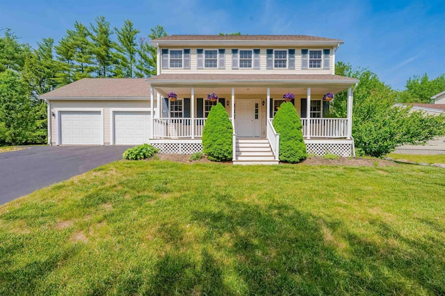 20 Brenda Ln, Rochester, NH 03867 - colonial inspired home with a porch, driveway, a garage, and a front yard